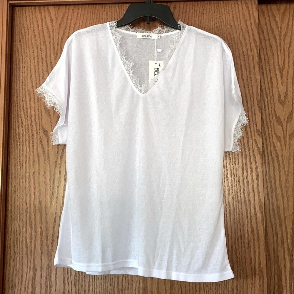 NWT White shirt with lace detail on sleeves and neck Never worn.